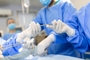 Picture7 | roma hospital Person holding their stomach with a glowing digestive system overlay, indicating abdominal pain or cramps.